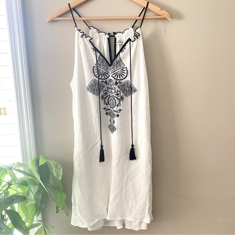 SPEECHLESS | white dress with black design and tassels
